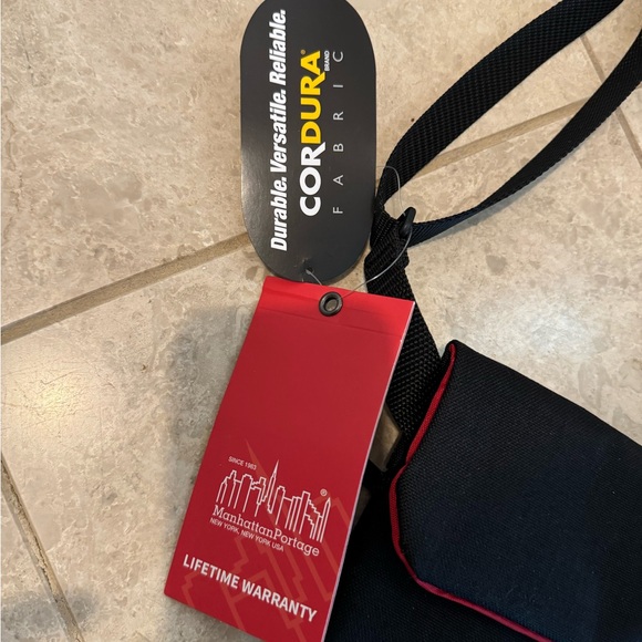 MANHATTAN PORTAGE crossbody.  Black with red lining. - Picture 3 of 9